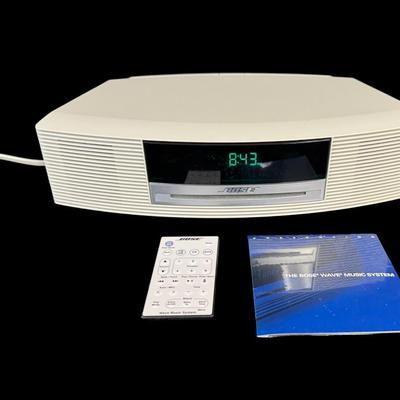 Sale Photo Thumbnail #220: This system has a single CD player, and an AM/FM radio. Includes an unopened instructional CD and remote. Powers on at time of catalog. Measurement: 14.5”W x 3.5”H. [JP]