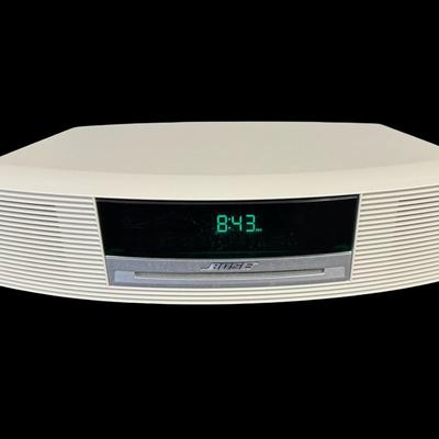 Sale Photo Thumbnail #221: This system has a single CD player, and an AM/FM radio. Includes an unopened instructional CD and remote. Powers on at time of catalog. Measurement: 14.5”W x 3.5”H. [JP]