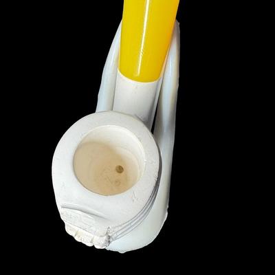 Sale Photo Thumbnail #225: Two pieces. Each is hand carved. One is unused. The amber colored piece has a crack (pictured), and may have been previously used. Two pipe stands are also included. Measurement of longest pipe: 5.75”L. [JP]