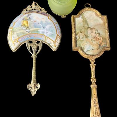 Sale Photo Thumbnail #232: Includes a porcelain Art Nouveau mirror, a brass portrait miniature mirror, and a French powder jar. Total of three pieces. There is age related wear, but all pieces are intact and unbroken. Measurement of longest: 8.75”L. Pre-auction estimate: $200-$30