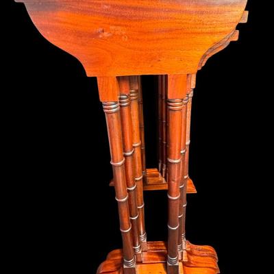 Sale Photo Thumbnail #248: These Revival design tables have distinctive faux bamboo legs, and feature a starburst of diamond shaped veneer inlay on the surface. Total of three pieces. Measurement of largest: 28”H x 17”W. [JP]