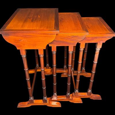 Sale Photo Thumbnail #247: These Revival design tables have distinctive faux bamboo legs, and feature a starburst of diamond shaped veneer inlay on the surface. Total of three pieces. Measurement of largest: 28”H x 17”W. [JP]