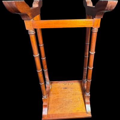 Sale Photo Thumbnail #250: These Revival design tables have distinctive faux bamboo legs, and feature a starburst of diamond shaped veneer inlay on the surface. Total of three pieces. Measurement of largest: 28”H x 17”W. [JP]