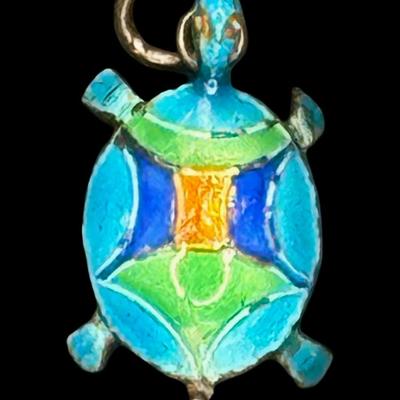 Sale Photo Thumbnail #274: Includes a marked 875 silver Russian cocktail fork (6.00g); a tested 950 silver (marked “silver”) Chinese export cloisonné turtle charm (1.06g); and a tested sterling pin (1.09g). Total of three pieces. Silver content confirmed using Niton XRF precio