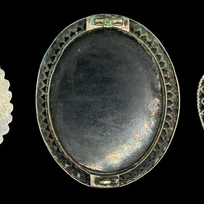 Sale Photo Thumbnail #283: Includes two “Alpacca” brooches, and one vintage brooch with a tested 800 silver filigree border. The vintage piece is missing the pin, and has age related wear. The mosaic on all three pieces appears to be intact. Measurement of largest: 2”W. Silve