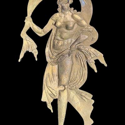 Sale Photo Thumbnail #294: This avant garde wall plaque is a classic example of flowing lines seen during this period. There is age related wear, including patina. Measurement: 13”L x 7”W. [JP]