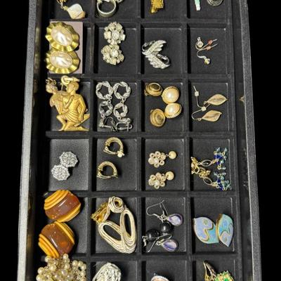 Sale Photo Thumbnail #295: Includes 25 pairs of earrings, and two single earrings. Some are vintage. There are clip-on earrings, as well as pierced earrings. Does not include display tray. [JP]