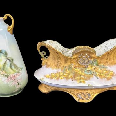 Sale Photo Thumbnail #309: Includes a console dish, and a bud vase. The bud vase has the artist’s signature on the base, and the console dish was made by Depose’ of Austria. There may or may not be flea bites or cracks in the glaze only. Measurement of longest: 8”L. [JP]