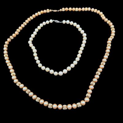 Sale Photo Thumbnail #327: Includes a hand-knotted pearl necklace, and a necklace with faux pearls and gold tone metal beads. Both necklaces have clasps that are stamped “14K.” Measurement of longest: 30”L. [JP]