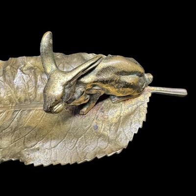 Sale Photo Thumbnail #332: This durable brass trinket tray is not only decorative, but functional. It is made in the manner of Delperier. It has patina commensurate with age. There is no obvious damage to this piece. Measurement: 13”L. [JP]