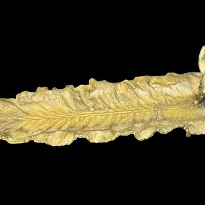 Sale Photo Thumbnail #331: This durable brass trinket tray is not only decorative, but functional. It is made in the manner of Delperier. It has patina commensurate with age. There is no obvious damage to this piece. Measurement: 13”L. [JP]