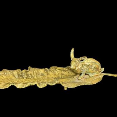 Sale Photo Thumbnail #330: This durable brass trinket tray is not only decorative, but functional. It is made in the manner of Delperier. It has patina commensurate with age. There is no obvious damage to this piece. Measurement: 13”L. [JP]