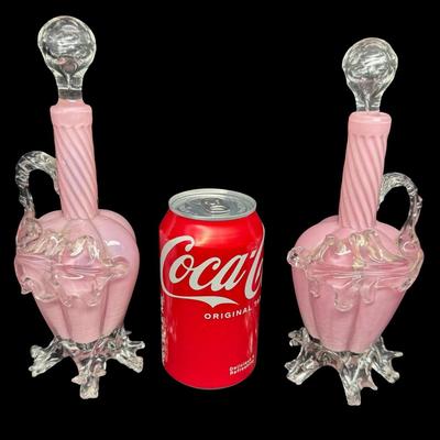 Sale Photo Thumbnail #348: These decanters have a swirl, or “Guttate” pattern. The stoppers are original. There are some chips on the fingers on the base of each; however, there are no significant cracks or damage to the stoppers. Measurement: 9”H (each). Pre-auction estimate