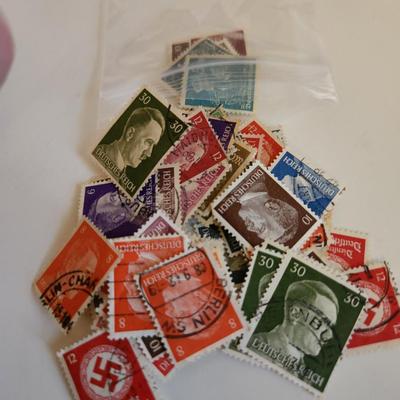 Sale Photo Thumbnail #185: This lot is for Collection of Third Reich Era Stamps,  The stamps show Hitler, Swastika and other Third Reich Symbols.  Some are unused, some have cancellation marks. There appears to be at least 30 stamps in the grouping.
