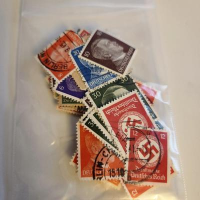 Sale Photo Thumbnail #184: This lot is for Collection of Third Reich Era Stamps,  The stamps show Hitler, Swastika and other Third Reich Symbols.  Some are unused, some have cancellation marks. There appears to be at least 30 stamps in the grouping.