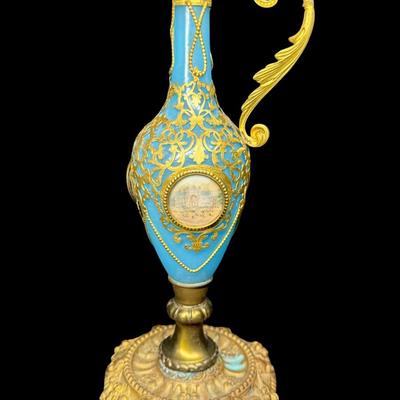 Sale Photo Thumbnail #384: This has gilt bronze mounts. The plastic cover is missing off one of the photos. Measurement: 10.5”H. Pre-auction estimate: $100-$200. [JP]