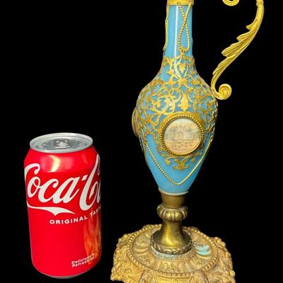 Sale Photo Thumbnail #385: This has gilt bronze mounts. The plastic cover is missing off one of the photos. Measurement: 10.5”H. Pre-auction estimate: $100-$200. [JP]