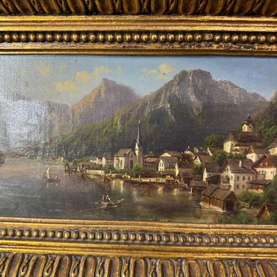 Sale Photo Thumbnail #389: In the manner of Lepie or Jankowsky, this 19th century piece depicts the picturesque village of Hallstatt, Austria. The piece has craquelure, commensurate with age. The artist signature is illegible due to the frame. The frame is 19th century. Measurement