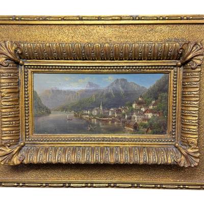 Sale Photo Thumbnail #391: In the manner of Lepie or Jankowsky, this 19th century piece depicts the picturesque village of Hallstatt, Austria. The piece has craquelure, commensurate with age. The artist signature is illegible due to the frame. The frame is 19th century. Measurement