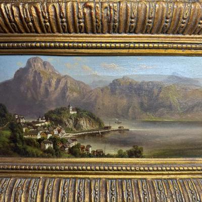 Sale Photo Thumbnail #395: In the manner of Lepie or Jankowsky, this 19th century piece depicts the picturesque village of Hallstatt, Austria. The piece has craquelure, commensurate with age. The artist signature is illegible due to the frame. The frame is 19th century. Measurement