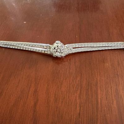 Sale Photo Thumbnail #2: 14K gold and diamond watch features a floral hinged cover and diamond bracelet with safety chain.  Watch movement 
text :  "Arlen Watch Co."   
Bracelet contains 99 round single cut melee diamonds, Additionally, there are 8 round brilliant diamonds .
Tota