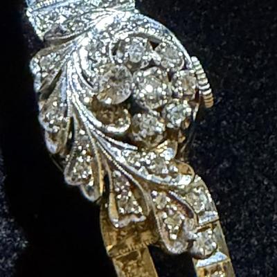 Sale Photo Thumbnail #3: 14K gold and diamond watch features a floral hinged cover and diamond bracelet with safety chain.  Watch movement 
text :  "Arlen Watch Co."   
Bracelet contains 99 round single cut melee diamonds, Additionally, there are 8 round brilliant diamonds .
Tota