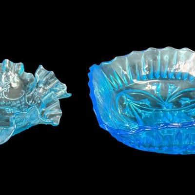 Sale Photo Thumbnail #406: Includes a Fenton water lily and cattails bowl, and a blue ruffled candy dish. Total of two pieces. Measurement of largest: 8”W. [JP]
