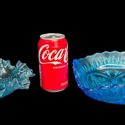 Sale Photo Thumbnail #407: Includes a Fenton water lily and cattails bowl, and a blue ruffled candy dish. Total of two pieces. Measurement of largest: 8”W. [JP]