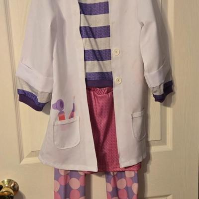 LOT 23: Child Size Dorothy Dress and 2 Disney Store Doc McStuffins Costumes