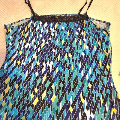 LOT 32: Women's Plus Size Colorful Tops Including Teal Cold Shoulder, Orange Ruffles, and More