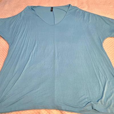 LOT 32: Women's Plus Size Colorful Tops Including Teal Cold Shoulder, Orange Ruffles, and More