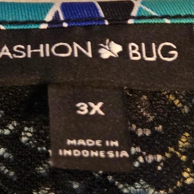 LOT 32: Women's Plus Size Colorful Tops Including Teal Cold Shoulder, Orange Ruffles, and More