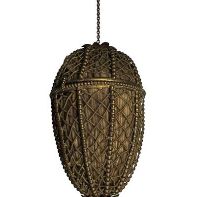 Sale Photo Thumbnail #417: Constructed of brass filigree with a teardrop or egg shaped design. It is hinged with a clasp and findings on either end. The lining inside show wear, although the integrity of the piece is solid. Measurement: 5”H. Pre-auction estimate: $100-$200. [JP]