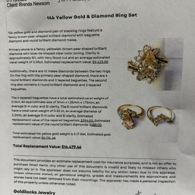 Sale Photo Thumbnail #15: 14K yellow gold and diamond pair of stacking rings feature a fancy brown pear-shaped brilliant diamond with baguette diamond and round brilliant diamond melee. The primary stone is valued at $9423.00
Additionally, there are melee diamonds between the two 