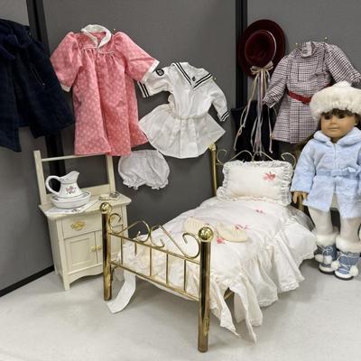 Sale Photo Thumbnail #18: One of the three historical characters introduced in 1986. 
Includes the brass bed and bedding ( 2 headboards,  each is missing one ball on the top).    
Also includes washstand, comb and brush, water pitcher, additional clothing.  All items pictured are 