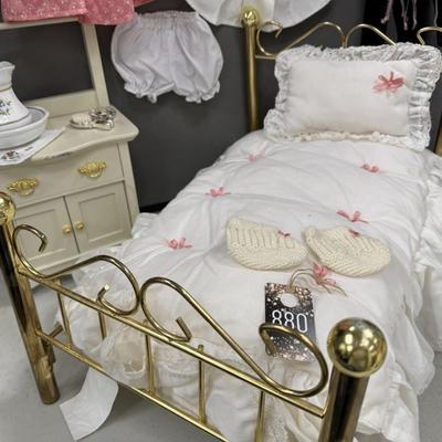 Sale Photo Thumbnail #17: One of the three historical characters introduced in 1986. 
Includes the brass bed and bedding ( 2 headboards,  each is missing one ball on the top).    
Also includes washstand, comb and brush, water pitcher, additional clothing.  All items pictured are 