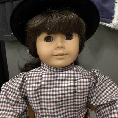 Sale Photo Thumbnail #21: One of the first historical figures introduced in 1986.  Includes the wooden desk, Samantha's story collection book with 6 editions, her loyal dog, several outfits, and her schoolbook pack.  There is slight wear on the body of the doll.