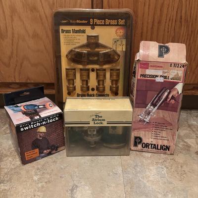 LOT 126: Orbit Brass Manifold Set Multi Hose Connector, Craftsman Precision Drill Guide, Brass Door Lock & a Drill Mount