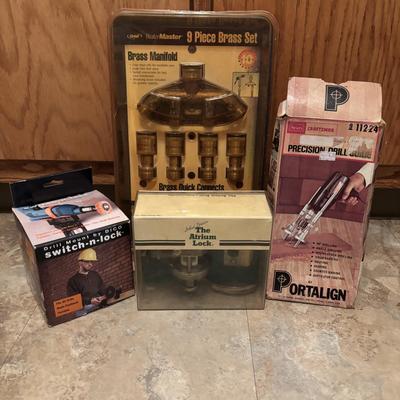 LOT 126: Orbit Brass Manifold Set Multi Hose Connector, Craftsman Precision Drill Guide, Brass Door Lock & a Drill Mount