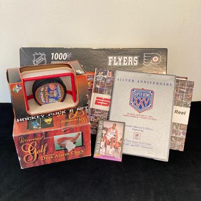 LOT 137: Sports Collection - Flyer's Stanley Cup Puck and Net / Puzzle, Golf Clock, Buick Super Bowl XXV Silver Anniversary Trading...