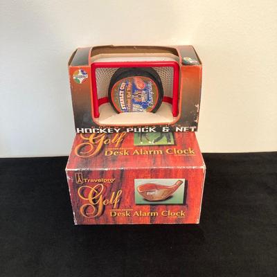 LOT 137: Sports Collection - Flyer's Stanley Cup Puck and Net / Puzzle, Golf Clock, Buick Super Bowl XXV Silver Anniversary Trading...