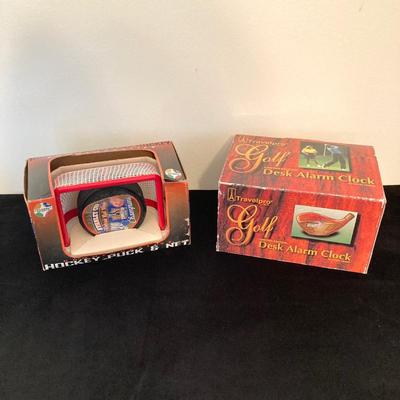 LOT 137: Sports Collection - Flyer's Stanley Cup Puck and Net / Puzzle, Golf Clock, Buick Super Bowl XXV Silver Anniversary Trading...