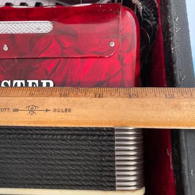 LOT 138: J. Meister Red Accordion with Carrying Case and Key