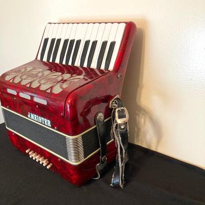 LOT 138: J. Meister Red Accordion with Carrying Case and Key