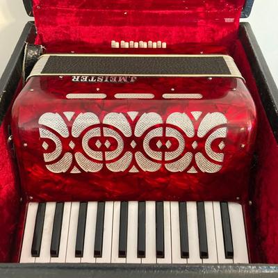 LOT 138: J. Meister Red Accordion with Carrying Case and Key
