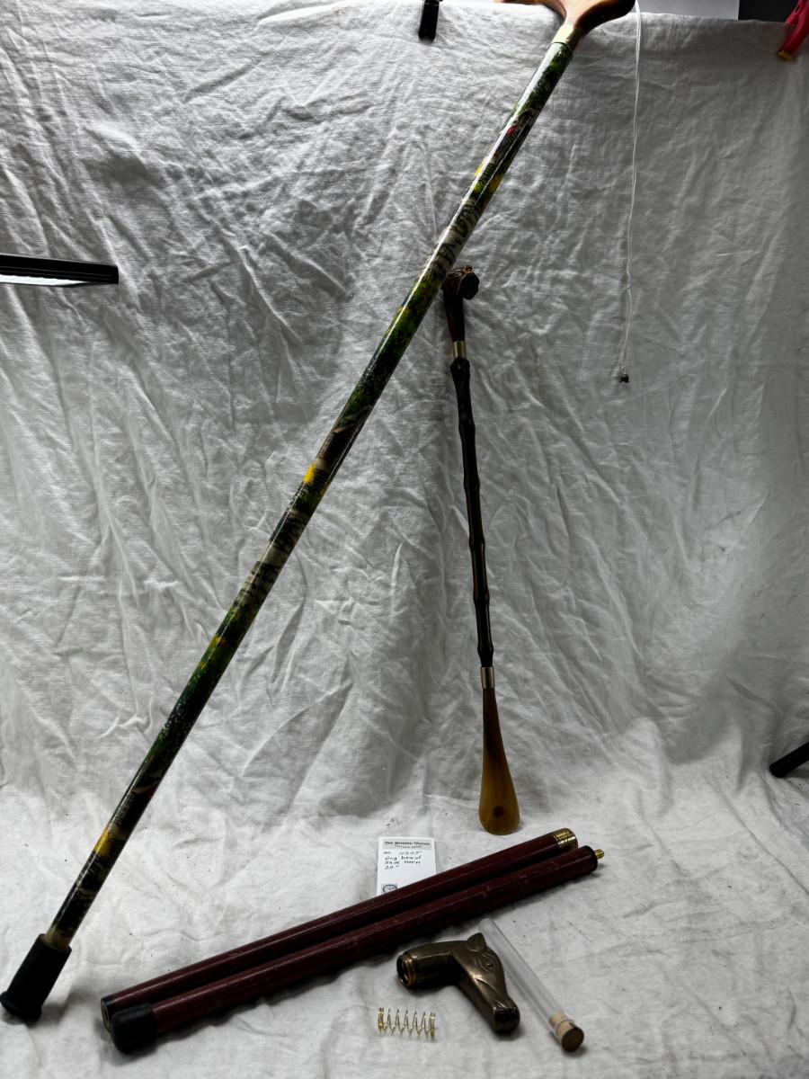 Sale Photo Thumbnail #548: Dog head (resin) with shell horn, marked with a drop of paint, Taiwan Brass Dog head stick breaks apart and top containes a corked glass vial , under that is a spring, and then the bottom third screws off too!
