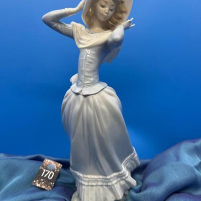 Sale Photo Thumbnail #31: Retired Lladro figure (2009) , 14 inches tall, no box 
Woman with hat and scarf in a Spring Breeze 
Original retail of $425.00
excellent condition