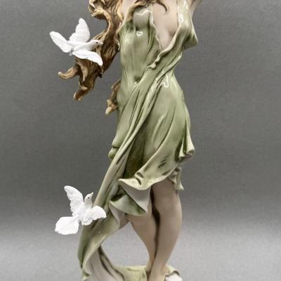 Sale Photo Thumbnail #68: This collectible figurine is in mint condition.  #1400 / 7500 Limited Edition
The porcelain figurine depicts a woman in a flowing green dress with doves/
From the Florence Sculpture d"Arte collection 
Retail's up to $1000
16 inches tall 
local pickup only