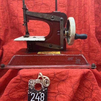 Sale Photo Thumbnail #94: from the 40s and 50s.  
Advertised as the toy sewing machine that really sews.
8.5 inches longs, 7 inches tall