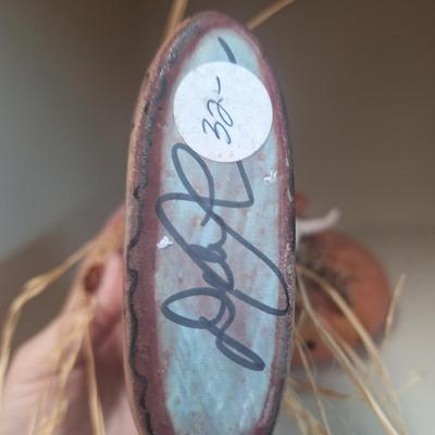 vintage native American art pottery- both are signed on bottom.